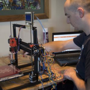 Brian Weis using 3D Printer